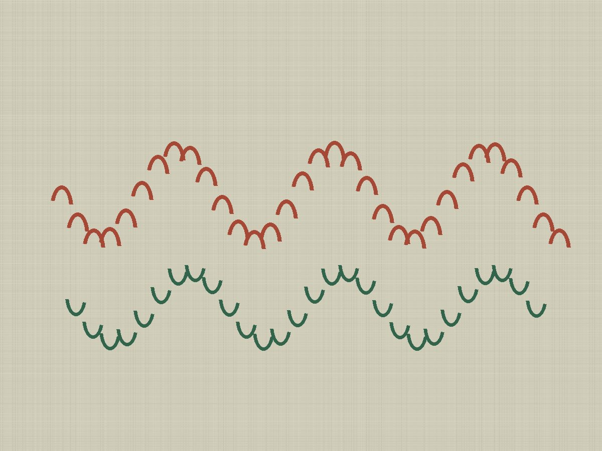 Close embroidery stitches in red and green